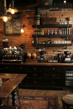 a brick wall in a coffee shop with lots of shelves