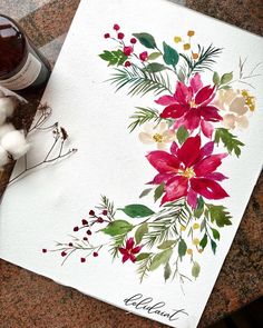 a watercolor painting of poinsettis and flowers on a white paper next to a bottle of wine