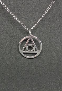 Philosopher's Stone recycled aluminum pendant necklace can be yours!  The most elusive element of alchemy is said to work miracles in the proper hands.  1.25 inches in diameter and polished to a magically mirrored finish. Silver Symbolic Circle Necklaces, Symbolic Silver Circle Necklace, Symbolic Silver Cadmium-free Charm Necklace, Aluminum Recycling, Philosopher's Stone, Philosophers Stone, Philosophers, Recycled Metal, Alchemy