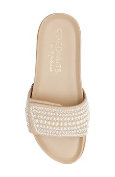 Pearly beads add an impeccably polished finishing touch to a sandal set on a contoured, arch-supporting footbed. 1 1/4" heel Adjustable hook-and-loop strap Contoured footbed with arch support Synthetic upper, lining and sole Imported Beige Slip-on Sandals With Textured Footbed, Beige Slip-on Slides With Arch Support, Non-slip Beige Flip Flops For The Beach, Beige Open Toe Sandals With Cork-bed Midsoles, Beige T-strap Sandals With Removable Insole For Beach, Sandal Women, Arch Support, Slide Sandals, Womens Sandals