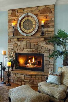 a living room with a stone fireplace and large clock on the wall above it's mantle