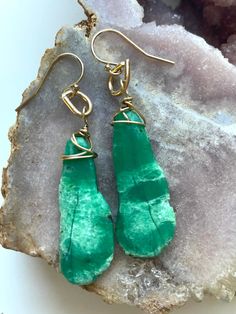 All done in gold filled these beautiful earrings are OOAK! Dangle length is 56mm. Gorgeous genuine green chrysoprase 💜 Light weight and comfortable in the ear. Gold filled metal and ear wire. Elegant Nickel-free Chrysoprase Jewelry, Handmade Elegant Chrysoprase Earrings, Elegant Handmade Chrysoprase Earrings, Unique Gold Jade Earrings, Green Brass Earrings With Natural Stones, Gold Wire-wrapped Jade Earrings, Gold Chrysoprase Earrings For Gift, Gold Chrysoprase Earrings As A Gift, Gold Jade Earrings With Natural Stones