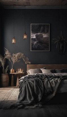 a bedroom with dark walls and wooden floors is lit by two hanging lights above the bed