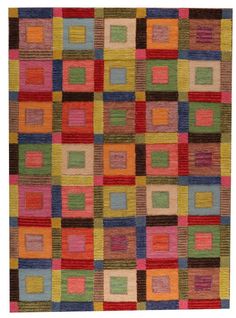 a multicolored rug with squares and rectangles