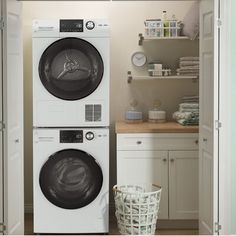 a washer and dryer in a laundry room with open closet doors to the side