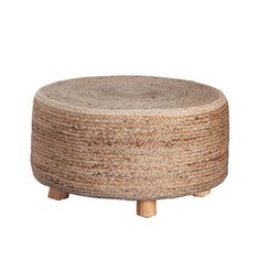 a round woven ottoman with wooden legs on an isolated white background for use as a coffee table or stool