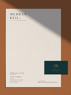 a letterhead and business card mockup on a brown background with a black logo