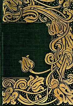 an old book with gold and black designs on it