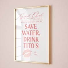 a pink and gold framed poster with the words save water, drink tio's