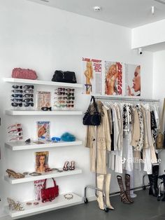 a white closet filled with lots of shoes and handbags on top of shelving units