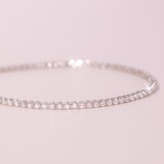 A slim, shining tennis bracelet, made of 100% recycled 14k gold and recycled brilliant cut diamonds. Catbird Jewelry, Diamond Tennis Bracelet, Tennis Bracelet Diamond, Recycled Gold, Metal Bracelets, Tennis Bracelet, O Clock, Brilliant Cut Diamond, White Diamond