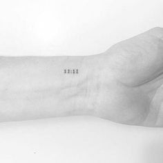 a black and white photo of a person's arm with the word love tattooed on it