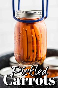 pickled carrots in a mason jar with text overlay that reads pickled carrots