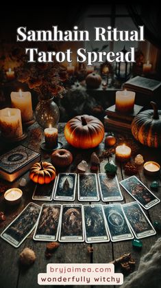 tarot spread with candles and pumpkins on the table