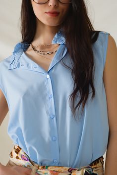 Elevate your wardrobe with our versatile mao collar sleeveless blouse in a classic shade of blue. This blouse features a button-up closure and is the perfect staple piece to have in anyone's closet. Its versatility allows it to be worn as a blouse, a vest, or even as a cover-up, making it suitable for year-round wear.  Crafted from a blend of 97% polyester and 3% polyamide, this blouse offers a luxurious satin feel that drapes beautifully on the body. The model, standing tall at 5'11" with measurements of 33-24-36, is wearing a size S, demonstrating how the blouse corresponds to US sizes of 4, 6, and 8, respectively. With its regular fit and high collar neckline, this blouse exudes sophistication and style.  Perfect for daily wear, this sleeveless blouse offers a standard fit that flatters Model Standing, Tan Scarf, Skirt Jumpsuit, Scarf Headband, Button Up Blouse, Romper Pants, Staple Pieces, Sweater Coats, Hat Hairstyles