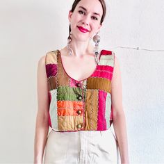 Handmade Antique Crazy Quilt Cropped Vest - Red, Brown, Orange, Green, And Gold Silk Patchwork - Hand Embroidery In A Zig Zag Pattern - Brass Buttons - Boxy Style - Cropped Style - Lined With Silk Printed Fabric - Made From An Antique Textile From The 1800s - Contrasting Piping Please Refer To The Measurements Carefully, As Returns Are Not Accepted: Modern Day Size Large Pit To Pit: 19.5” Waist: 20” Length: 16” (Model Is 5’8”) *All Measurements Are Taken Flat* Worn Oversized On A Model Who Normally Wears A Size Small Condition: Stunning! Considering The Age Of The Textile (It’s Over 100 Years Old), It Is In Great Condition. One Teeny Cheap Patterned Patchwork Blouse, Vest Patches Women, Vest Patchwork Vintage, Red Bohemian Patchwork Top, Red Bohemian Top With Patchwork, Patchwork Vest Pattern, Women Waistcoat, Silk Patchwork, Quilt Shirt