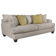 a gray couch with yellow pillows on the arm and back cushions in front of it