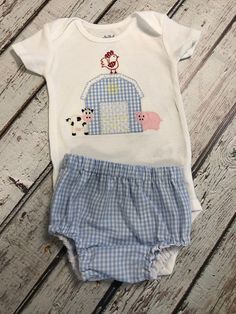 This cute outfit has an appliquéd Barn with appliquéd Cow, pig and rooster farm animals on a bodysuit or T-shirt with Matching Blue Gingham pants, shorts or diaper cover. **i primarily use Carter brand Just For You bodysuits that come in whole number sizes but if you prefer the Carter brand Child of Mine that comes in a different sizing number (ex. 0-3, 3-6) just let me know. This outfit can come with or without name. Just let me know if you don't want a name. Thank you for visiting my shop. Ple Cute Fitted Gingham Sets, Cute Plaid Cotton Sets, Fitted Gingham Cotton Sets, Cute Gingham Cotton Sets, Spring Playful Gingham Bottoms, Gingham Cotton Short Sleeve Set, Gingham Cotton Set With Short Sleeve, Cute Gingham Cotton Bottoms, Boy Monogram