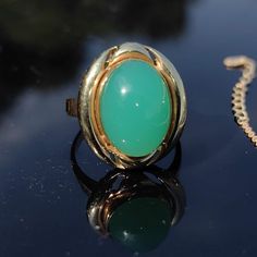 RING SIZE:   6 3/4 US, 54 EU [FREE RESIZING] TOP PART SIZE: 16mm x 20mm MATERIAL: Hallmarked 14k yellow gold WEIGHT: 5.60 grams STONES: Chalcedony CHALCEDONY: 11mm x 16mm CONDITION: Very good, no visible damages Stunning Chalcedony gold  ring. It is comfortable to wear and adds a nice pop of bright green colour to any outfit. Your item will come boxed and wrapped carefully, sent insured by Fedex priority Mail. The delivery takes around 1-3 days to the USA and Europe. Ring Antique, Yellow Gold Ring, Vintage Ring, Vintage 1960s, Yellow Gold Rings, Statement Ring, Rings Statement, Antique Vintage, Priority Mail