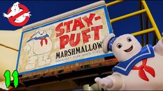 a sign that says stay puft marshmallow next to a ghost