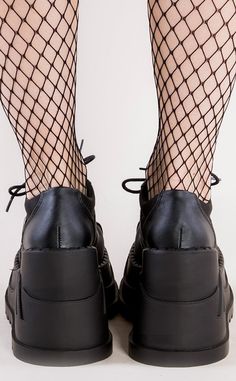 The stompiest booties around! These lace up wedges are the perfect sneaker-esque boot for all your casual outing needs. Vegan Black PU leather 4 3/4 inch platform Patent sporty stripes Platform sneaker U.S women's sizing-refer to size chart for more info.