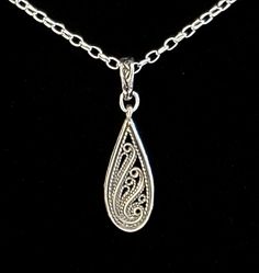 "- Gorgeous Antiqued 925 Sterling Silver Paisley Floral Etched Design Pendant, or Necklace, with Antique Silver Plated Brass Self-Closing Bail in Vine motif. See Photos #1-4. - Beautiful Etched Detailing in popular Paisley Floral Design. - 925 Sterling Silver Filled Oval Rolo Chain included. - 20\" Length. - Closure with Antique 925 Sterling Silver Plated Pewter Hook & Eye Clasp in Vine motif. See Photo #5. - Upon request, we can customize, at no cost, the Clasp type. Other Clasps available Silver Flats, Gold Cross Pendant, Paisley Floral, Hammered Gold, Teardrop Pendant, Gold Cross, Pink Earrings, Rolo Chain, Star Earrings