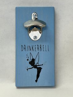 a bottle opener with a tinkerbell design on it