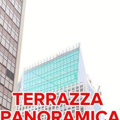 the words terrazza panoramica in front of tall buildings