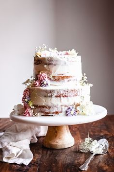 a white cake sitting on top of a wooden table