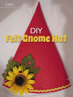 a felt gnome hat decorated with sunflowers and greenery is featured in the magazine, diy felt gnome hat