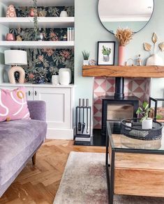 a living room filled with furniture and a mirror on top of a fireplace mantel