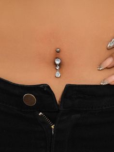 a close up of a woman's stomach with jewelry on it