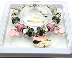 a bracelet with minnie mouse charms on it