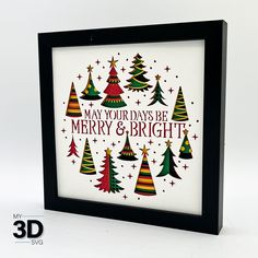 a framed christmas card with trees and stars on it, says may your days be merry & bright