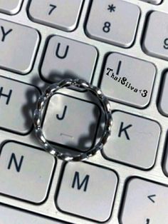 a metal ring sitting on top of a computer keyboard