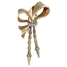 This is an elegant bow shape pin brooch crafted in 18K yellow gold and adorned with PT900. Circa 1950. The piece features 19 diamonds: round brilliant cut, TW 0.35ct, RW-W, SI. Has a safe clasp. Weight: 21.19g Length: 8.5cm Width (at max): 4.5cm ——— If you have any questions, please feel free to ask. We describe our items accurately. Please note that in reality they can look much better because photo can’t capture that magical sparkle. We have many years of experience in this business. And we have a very carefully curated selection of pieces. You can buy with confidence. Thank you for your consideration. ——— "Laura Antiques Fine Jewellery” is a successful family-owned business since 2009. Our enthusiasm for finding fine jewellery around the world and establishing a long-lasting relationshi Diamond Bows, David Webb, Diamond Brooch, Estilo Art Deco, Christian Lacroix, Antique Jewellery, Rose Cut Diamond, Fine Jewellery, Pin Brooch