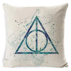 a harry potter pillow with watercolor splatters on the front and back of it