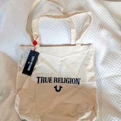 True Religion Nwt Canvas Tote Casual White Bag With Logo, Casual White Bags With Logo, Casual Beige Bag With Logo, Casual Everyday Bags With Logo, Tan Cotton Bags For Daily Use, Casual Logo Shoulder Bag For Shopping, Casual Shoulder Bag With Logo For Shopping, Casual Bags With Logo For Daily Use, Casual Bag With Logo For Daily Use