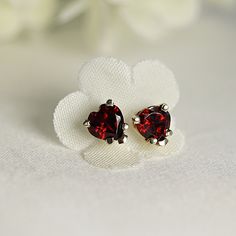 Minimal, modern, heart garnet stud earrings. 14k gold prong setting red gemstone earrings. Great gift for January borns. SOLD AS PAIR. Available white gold or yellow gold from drop down menu. Material; *** 14k solid gold studs *** Heart garnets 5mm *** 5 Prong settings. *** 14k gold backings included. Garnet is the stone that represent symbol of love and friendship. Garnet is January birthstone and 2nd anniversary birthstone. Garnet symbolizes a strong love or romantic connection. It carries the Romantic Connection, Garnet Heart, Red Heart Earrings, Modern Heart, 2nd Anniversary, Heart Stud Earrings, January Birthstone, Red Gemstones, Garnet Earrings