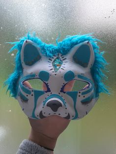 This mythical sea cat mask is looking for a home! It has blue fluffy fur around the edges and a "glass pane" third eye.  - Not felted - Can be worn with glasses with caution Blue Masks For Halloween Cosplay, Blue Halloween Cosplay Masks, Blue Full Face Mask For Cosplay, Blue Full Face Masks And Prosthetics For Cosplay, Cat Mask Diy, Therian Masks, Therian Stuff, Therian Mask, Cute Masks