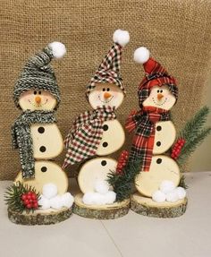 three snowmen are standing next to each other in front of a burlock