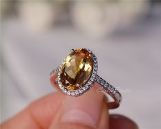 Gorgeous 8*12 mm oval Citrine ring, made with 925 sterling silver, plated with white gold. Main Stone: 8*12 mm Natural Citrine Side Stone: CZ Need other size please contact. CS0100 Yellow Oval Topaz Ring With Halo Setting, Pear Sapphire Ring, Citrine Engagement Ring, Citrine Ring Engagement, November Birthstone Ring, Vintage Halo, Statement Ring Silver, Yellow Citrine, Fancy Jewellery