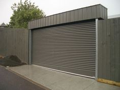 a closed garage door on the side of a building