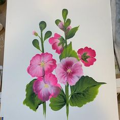 a painting of pink flowers and green leaves on a white sheet with watercolor pencils