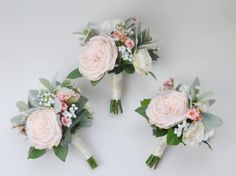 three bridal bouquets with pink and white flowers