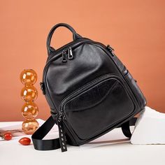 Elevate your everyday look with the ModishLeather Zipper Backpack, a fashion-forward accessory that combines style and functionality. Crafted with genuine leather and featuring embossed technics, this backpack exudes luxury and sophistication. With multiple compartments, a reliable zipper closure, and adjustable straps for maximum comfort, this backpack is the perfect companion for work, school, or a weekend getaway. Upgrade your style game and make a fashion statement with the ModishLeather Zipper Backpack today. Tassel Decoration, Wristlet Wallet, Office Casual, Weekend Getaway, Black Bag, Casual Everyday, Black Backpack, Signature Style, Accessories Shop