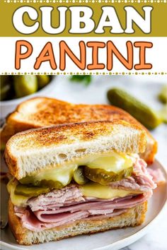 a grilled ham and jalapeno sandwich on a plate with the words cuban panini