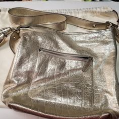 I Am Selling Many Bags From My Sisters Collection While Working At Coach. Bags Are All Like New, Dust And Scuff Free Kept In Dust Bags In A Pet Free Closet. This Bag Is A Coach Bucket Legacy Duffel Convertible 19894 Gold Silver Leather Cross Body Bag 13"L X 5"W X 12"H Silver Bag, Silver Bags, Leather Cross Body Bag, Leather Cross, Cross Body Bag, Rebecca Minkoff Hobo, Body Bag, Leather Crossbody Bag, Coach Bags