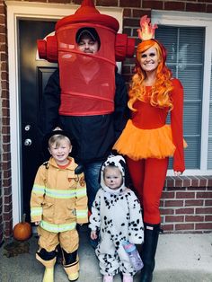 two children and an adult are dressed up in costumes