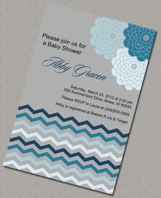 a baby shower is shown with blue and gray flowers on the front, and grey chevron